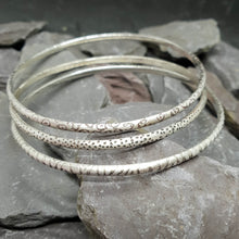Load image into Gallery viewer, Animal print patterns acid etched onto sterling silver bangles. Including leopard, dalmatian and zebra print.