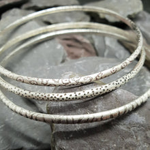 Load image into Gallery viewer, Animal print patterns acid etched onto sterling silver bangles. Including leopard, dalmatian and zebra print.