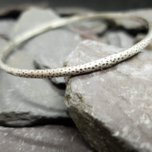 Load image into Gallery viewer, Dalmation print acid etched into a sterling silver bangle.