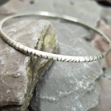 Load image into Gallery viewer, Zebra print pattern acid etched onto sterling silver bangles.