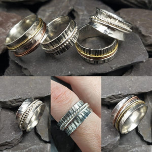 Three metal silver spinner ring